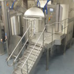 Steps leading to steam jacketed kettle