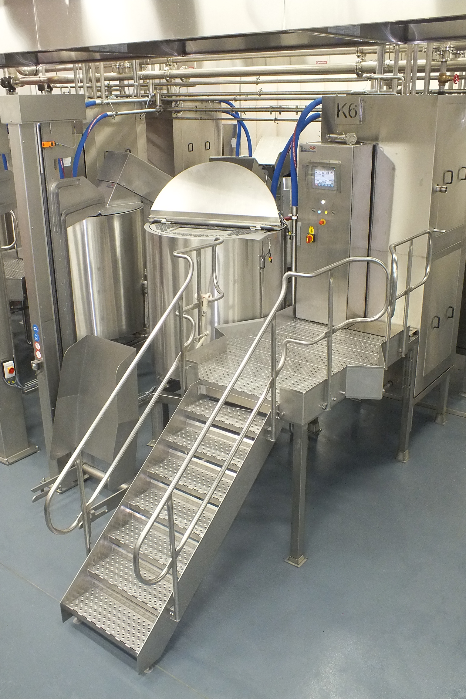 Steps leading to steam jacketed kettle