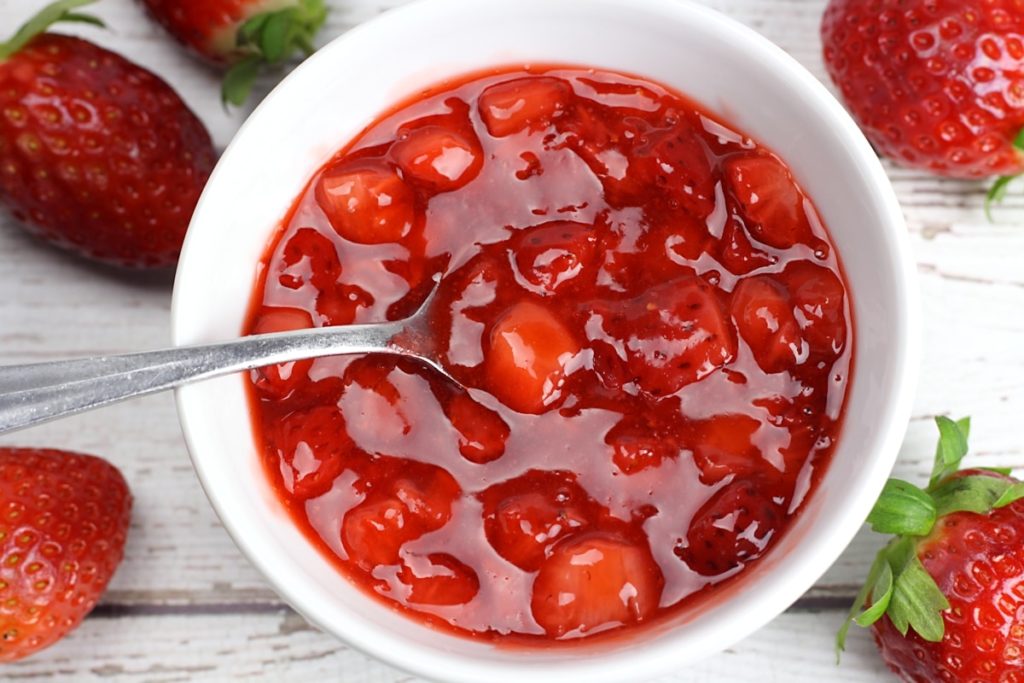 A bowl of strawberry topping