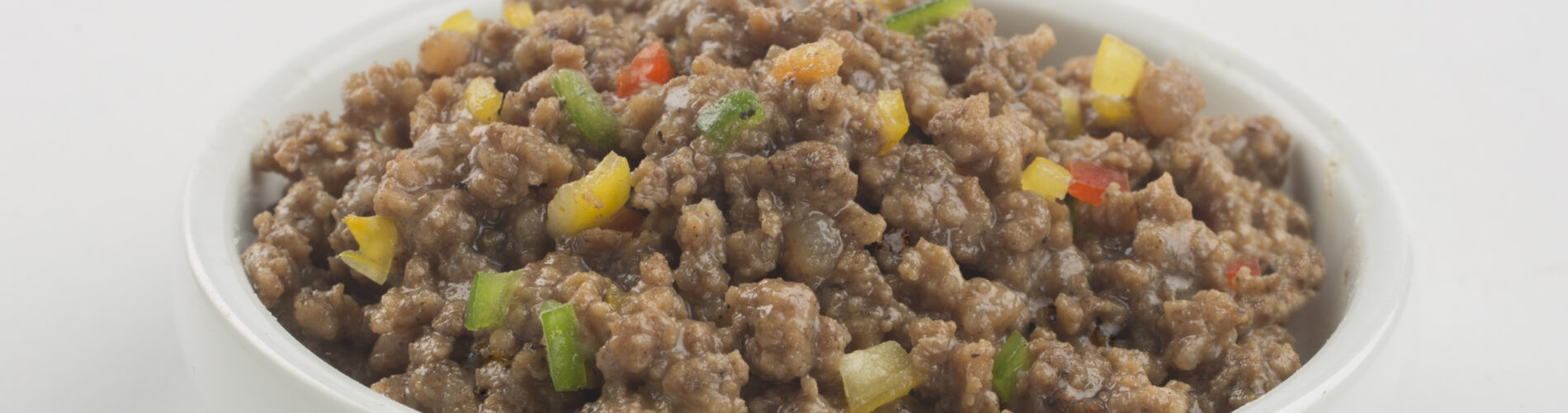 Prepared wet pet food in a bowl illustrating the final stage of the pet food production process before packaging.