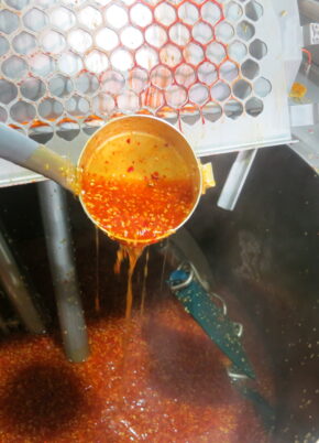 An industrial steam jacketed kettle processes a sauce to support consistent large-scale food production.